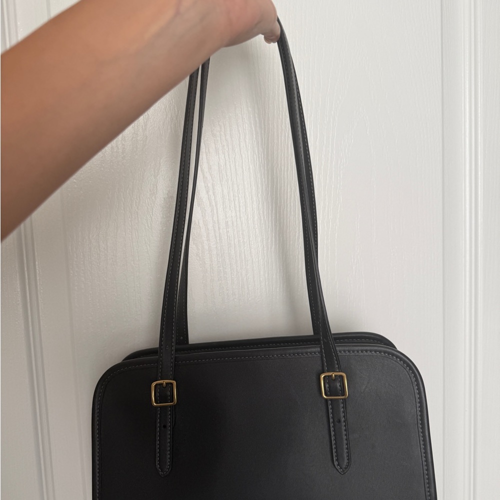 Coach black swing zip